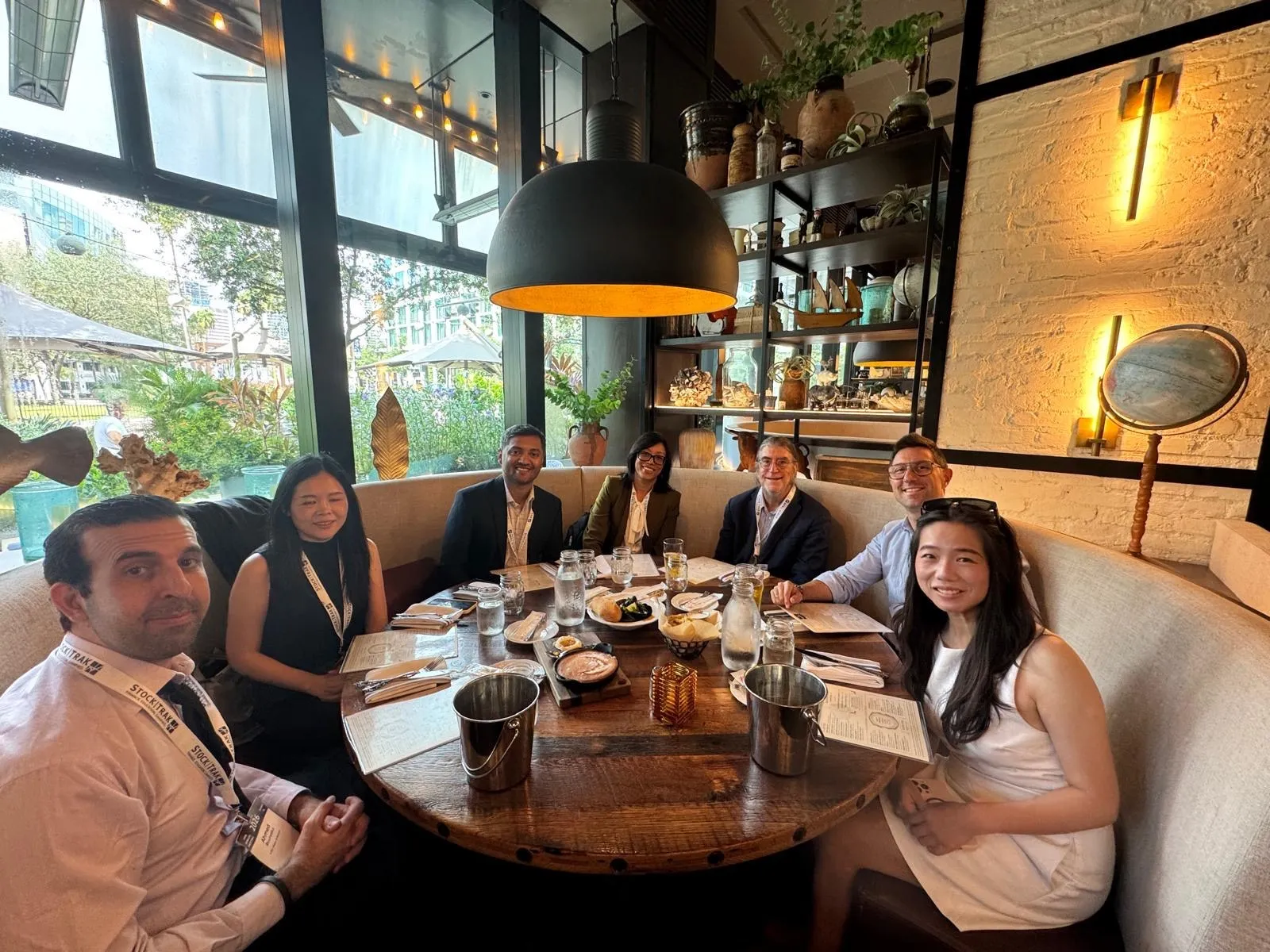 M. R. Hoque at a lunch table with Philip H. Dybvig and coauthors in Tampa